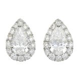 A pair of vari-cut diamond cluster earrings.Estimated total diamond weight 1ct,
