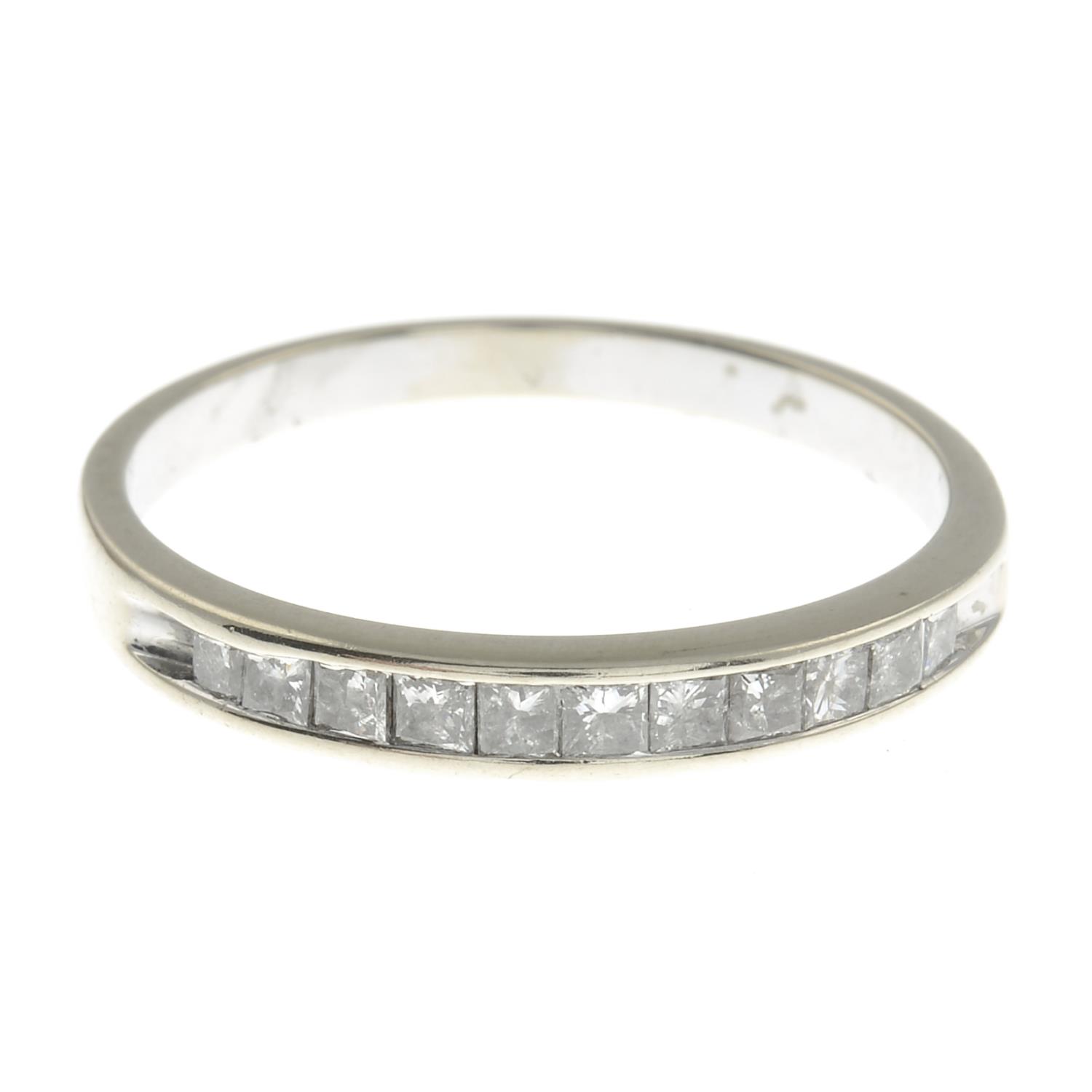 A square-shape diamond half eternity ring.