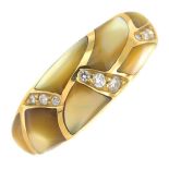 An 18ct gold mother-of-pearl and diamond ring.Estimated total diamond weight 0.15ct.Hallmarks for