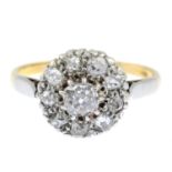 An early 20th century 18ct gold and platinum old-cut diamond cluster ring.Estimated total diamond