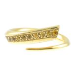 An 18ct gold yellow sapphire dress ring.