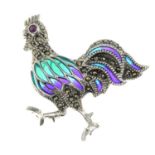 A ruby, pyrite and plique-a-jour enamel brooch, depicting a rooster.May be worn as a pendant.