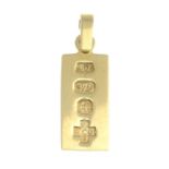 A 9ct gold ingot pendant.Hallmarks for 9ct gold.