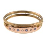 An Edwardian 9ct gold sapphire and rose-cut diamond hinged bangle.Central panel with hallmarks for