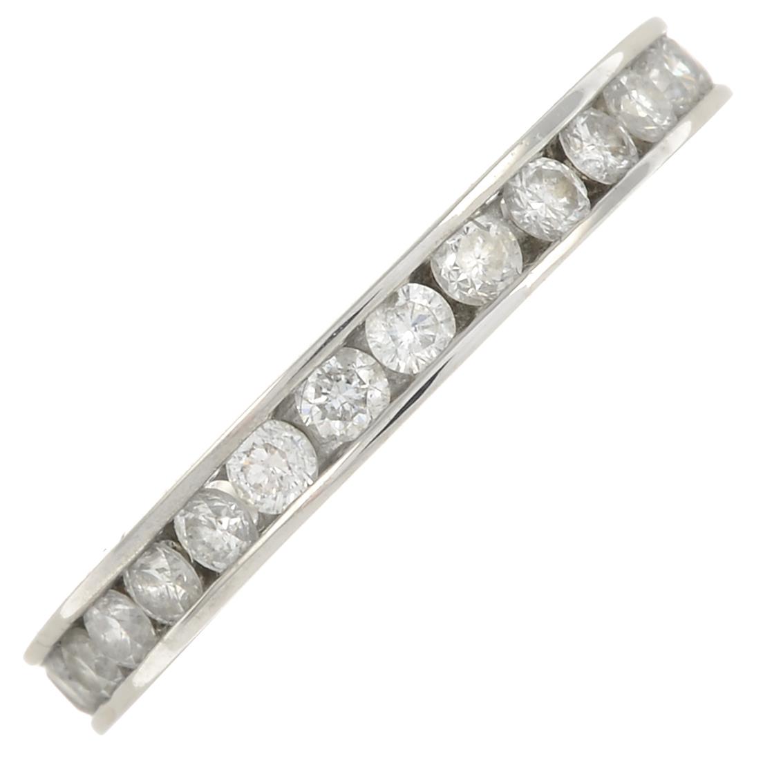 An 18ct gold brilliant-cut diamond full eternity ring.Estimated total diamond weight 1.10cts,