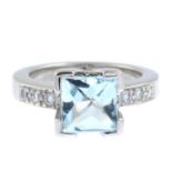 An aquamarine and diamond dress ring.Estimated total diamond weight 0.10ct.