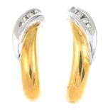 A pair of 18ct gold diamond earrings.Estimated total diamond weight 0.10ct,