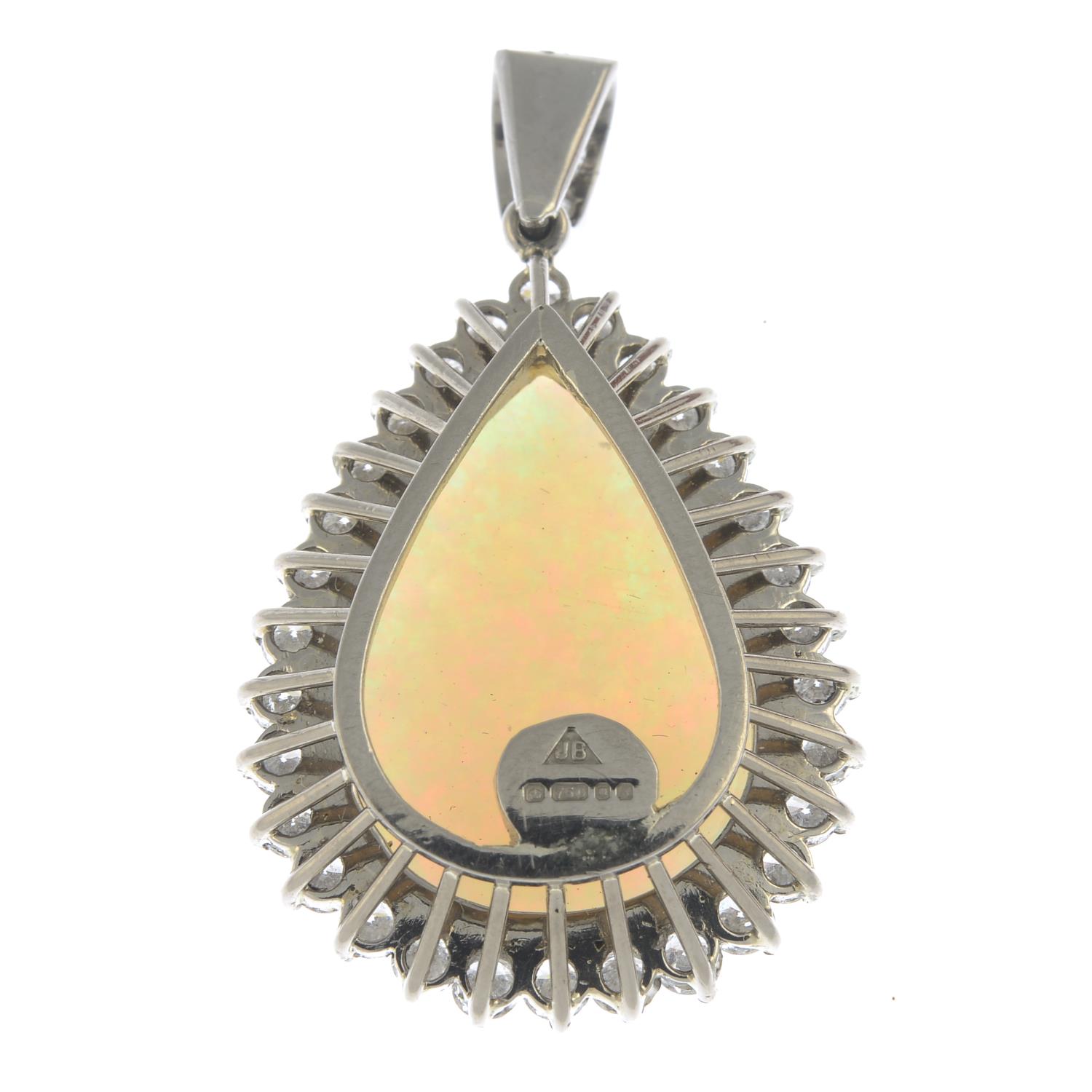 An 18ct gold opal and brilliant-cut diamond cluster pendant.Estimated dimensions of opal 23.3 by - Image 2 of 4