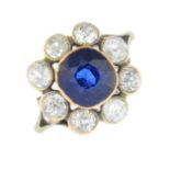 A sapphire and circular-cut diamond cluster ring.Sapphire calculated weight 2.24cts,