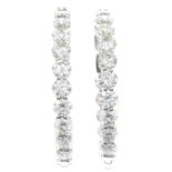 A pair of brilliant-cut diamond hoop earrings.Estimated total diamond weight 5.70cts,