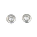 A pair of 18ct gold brilliant-cut diamond stud earrings.Estimated total diamond weight 0.25ct,