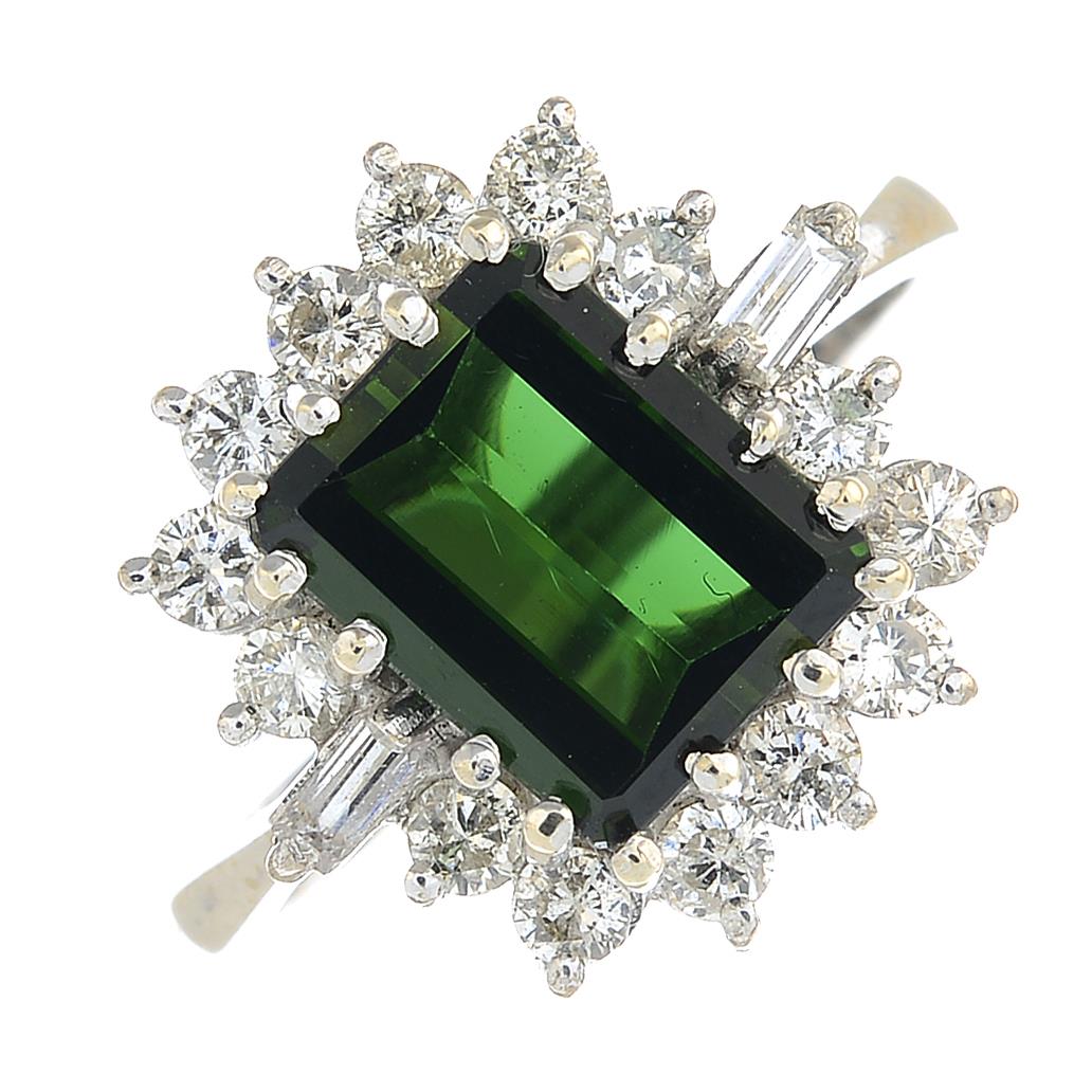 An 18ct gold green tourmaline and vari-cut diamond cluster ring.Tourmaline calculated weight