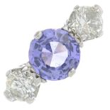 A Madagascan purple sapphire and brilliant-cut diamond three-stone ring.