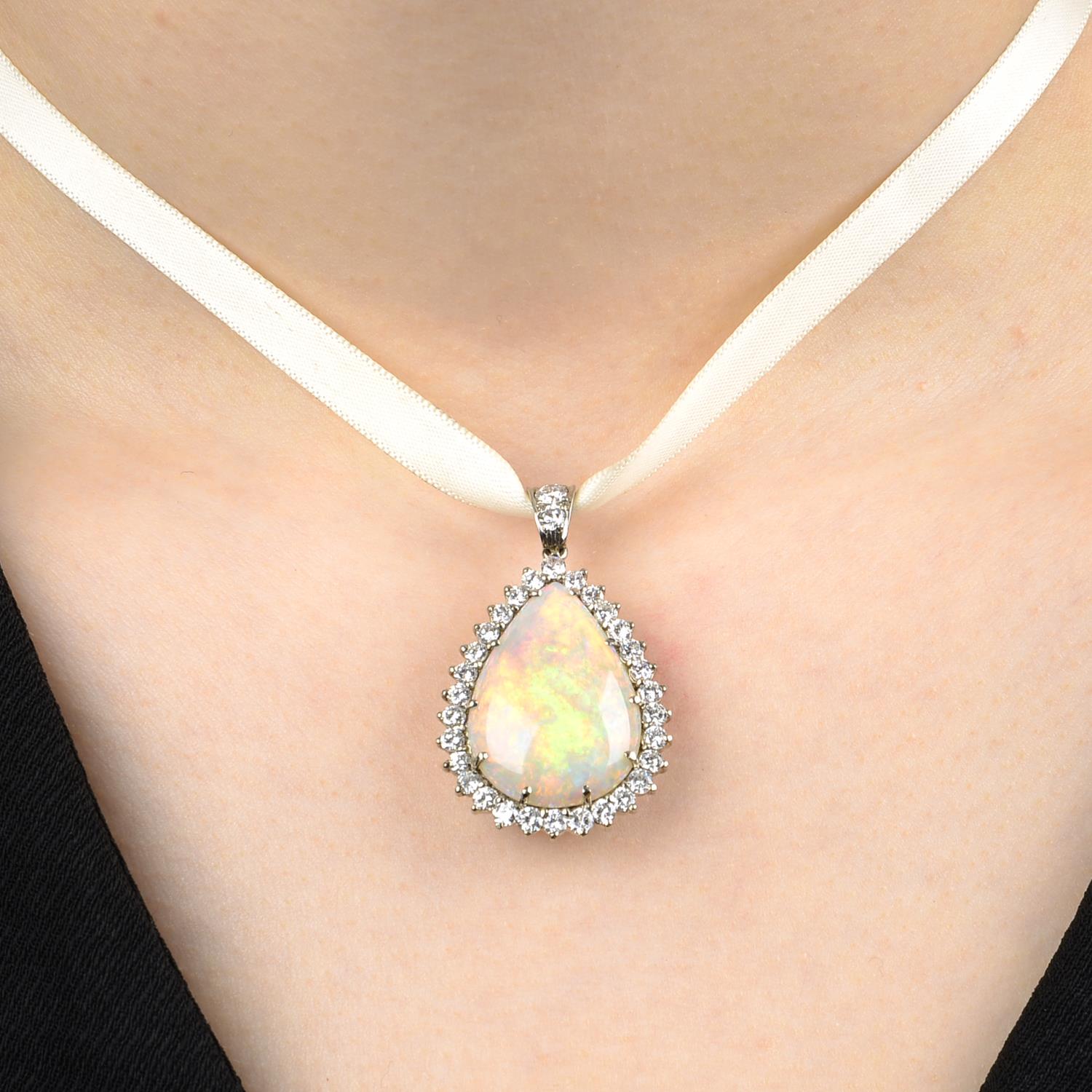 An 18ct gold opal and brilliant-cut diamond cluster pendant.Estimated dimensions of opal 23.3 by - Image 3 of 4
