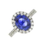 A platinum sapphire and brilliant-cut diamond cluster ring.Sapphire calculated weight 2cts,