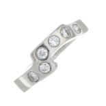 A platinum brilliant-cut diamond shaped band ring.Estimated total diamond weight 0.30ct,