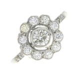 A brilliant-cut diamond cluster ring.Estimated total diamond weight 0.70ct,