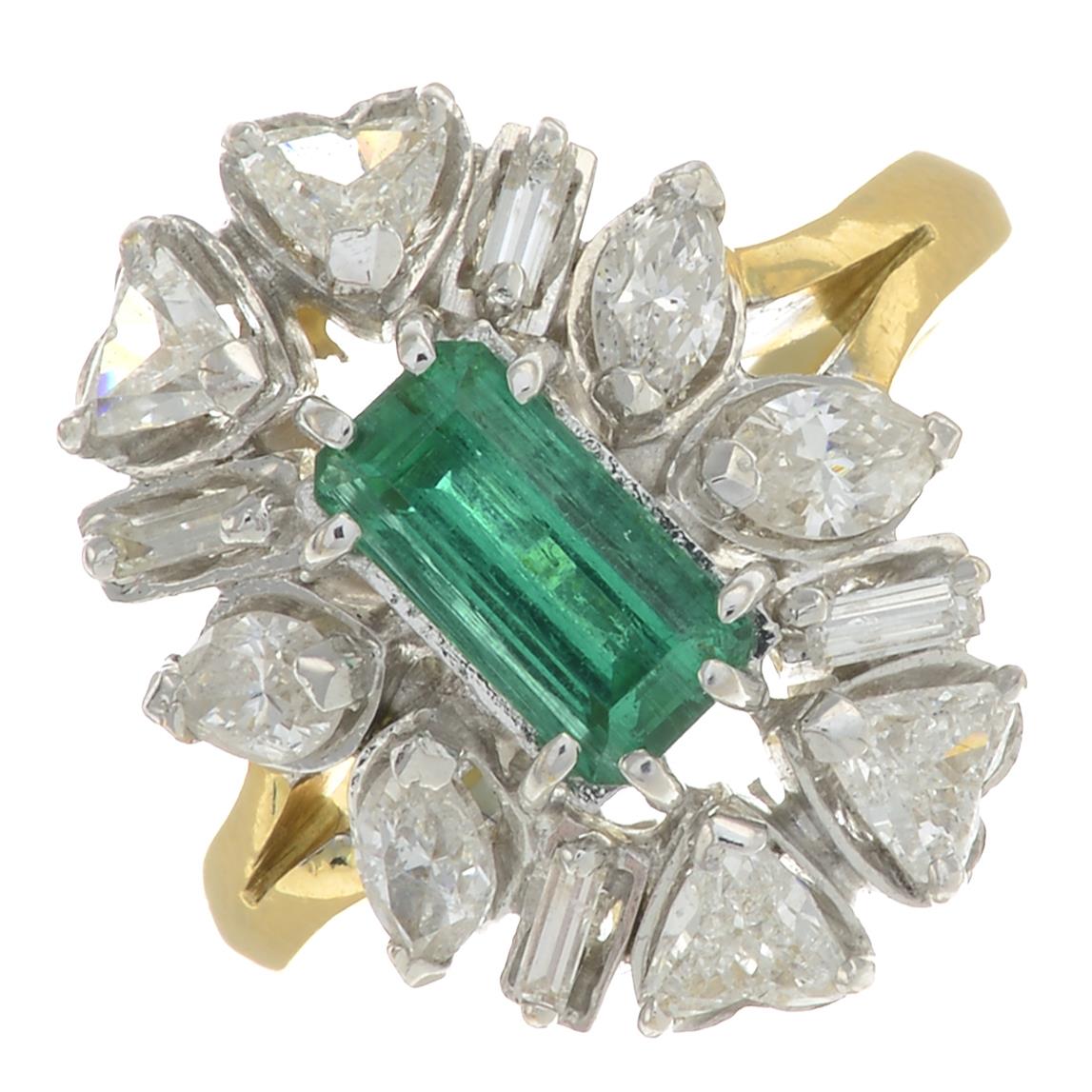 An emerald and vari-cut diamond cluster ring.