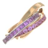 An 18ct bi-colour gold pink sapphire band ring.