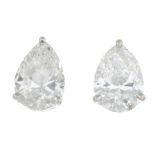 A pair of pear-shape diamond single-stone stud earrings.Estimated total diamond weight 1.70cts,