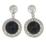 A pair of onyx and circular-cut diamond earrings.Estimated total diamond weight 0.60ct,