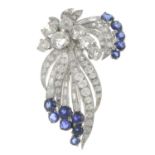 A mid 20th century platinum vari-cut diamond and sapphire brooch.Estimated total diamond weight