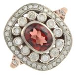 A garnet and brilliant-cut diamond dress ring.Garnet calculated weight 0.66ct,