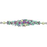 A brilliant-cut diamond and gem-set bracelet.Gems to include emerald, sapphire ruby and peridot.