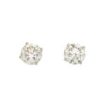 A pair of 18ct gold brilliant-cut diamond single-stone stud earrings.Estimated total diamond weight