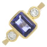 An 18ct gold rectangular-shape tanzanite and brilliant-cut diamond three-stone ring.Tanzanite