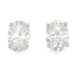 A pair of 18ct gold oval-shape diamond single-stone stud earrings.Estimated total diamond weight