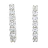 A pair of brilliant-cut diamond hoop earrings.Estimated total diamond weight 2.80cts,