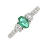 An 18ct gold emerald and vari-diamond set ring.Emerald weight 0.34cts.Diamond weight