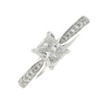 A platinum rectangular-shape diamond single-stone ring,