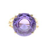 A synthetic colour-change sapphire single-stone ring.Ring size P.