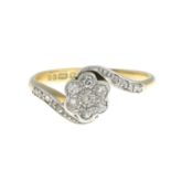 An 18ct gold diamond floral cluster ring.Estimated total diamond weight 0.15ct.Hallmarks for