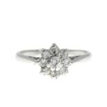 A diamond cluster ring.Estimated total diamond weight 0.30ct,