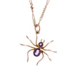 An early 20th century gold amethyst spider pendant, with chain.Length of pendant 3.5cms.