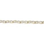 A vari-cut diamond bracelet.Estimated total diamond weight 2.25cts.Stamped 14K.Length 19cms.