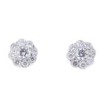 A pair of brilliant-cut diamond floral cluster earrings.Estimated total diamond weight 1ct,