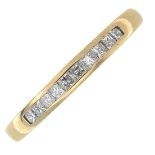 A 9ct gold square-shape diamond half eternity ring.Total diamond weight 0.25ct.
