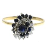 An 18ct gold diamond and sapphire dress ring.Estimated total diamond weight 0.30ct.