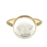 A carved moonstone dress ring, depictng 'Man in the Moon'.Stamped 9ct.Ring size L.