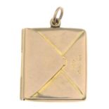 An early 20th century 9ct gold stamp holder, depicting an envelope.