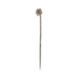 An early 20th century gold split pearl and old-cut diamond floral cluster stickpin.