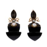 A pair of onyx, split pearl and enamel earrings.