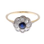 A sapphire and diamond floral cluster ring.