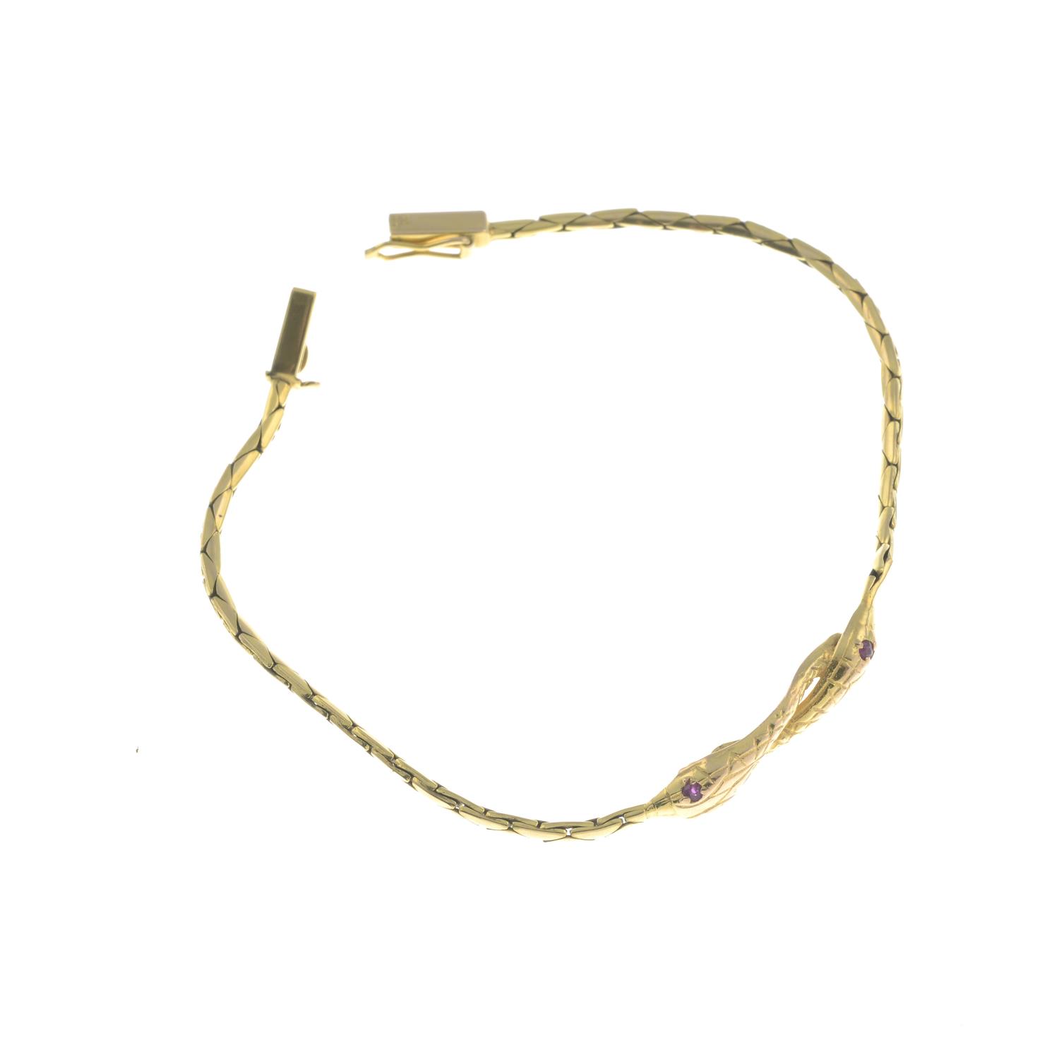 A 9ct gold snake bracelet, with ruby eyes. - Image 2 of 2