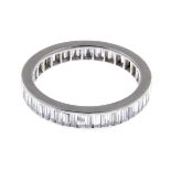 A baguette-cut diamond full eternity ring.