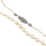 A cultured and seed pearl necklace, with diamond clasp.Length 47cms.